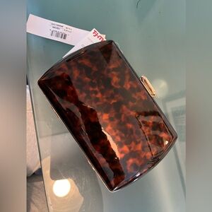 Tortoise hard clutch with strap